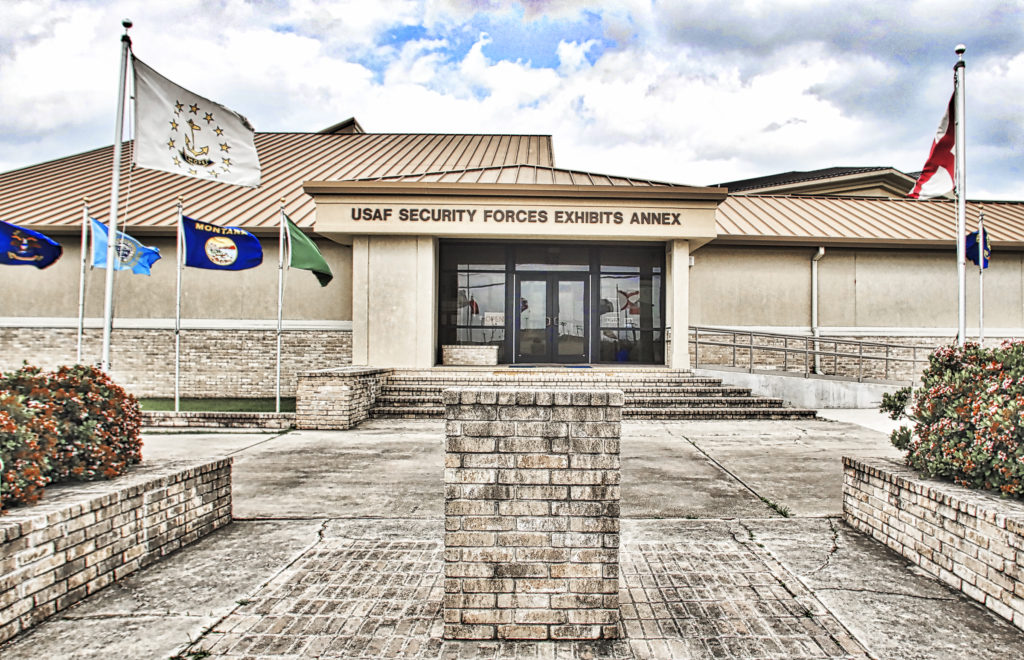 Picture front of museum with flags