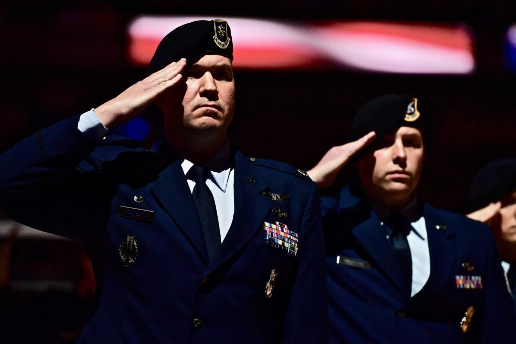 AF member in blues saluting